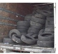tires unloaded into trailer