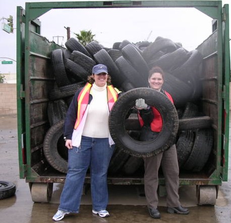 contractors pose with tires