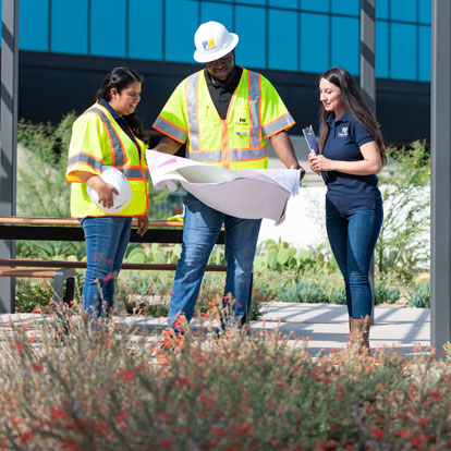 Workers with blueprint image