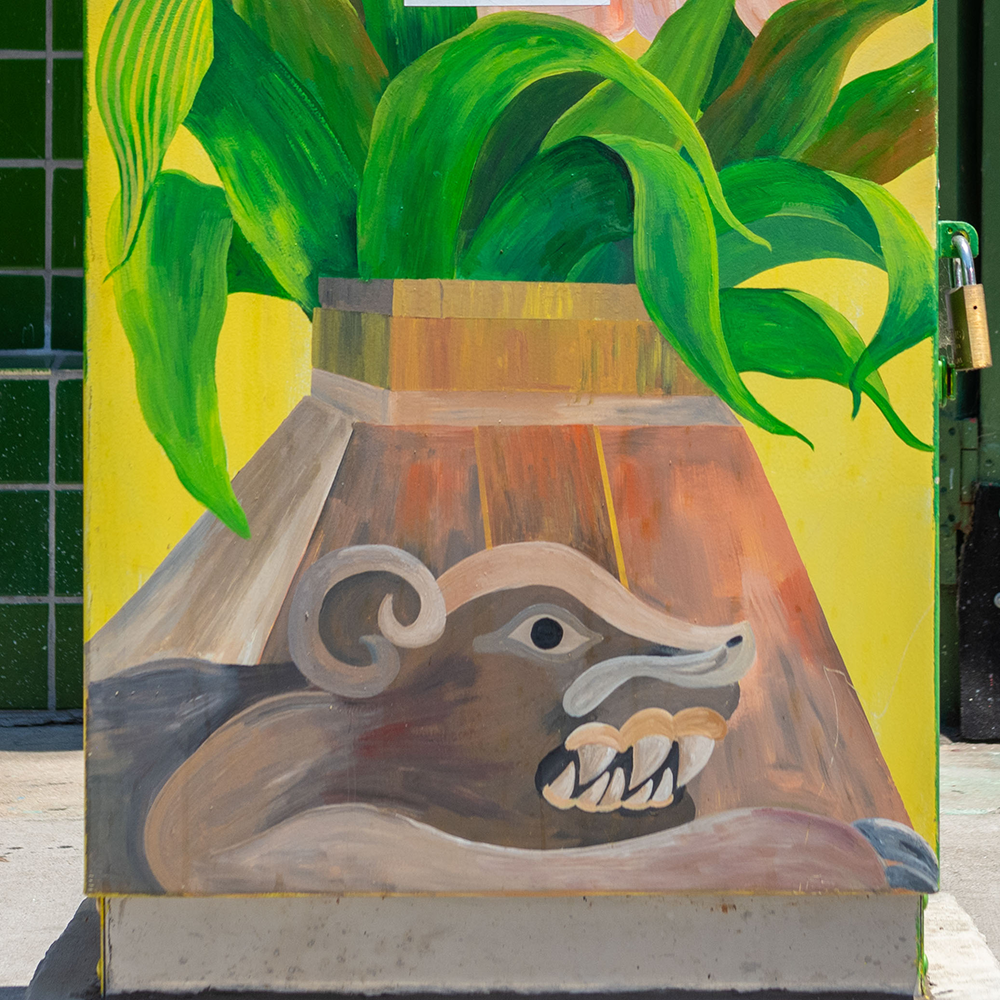 artistic utility box depicting a planter box with a badger at its base.